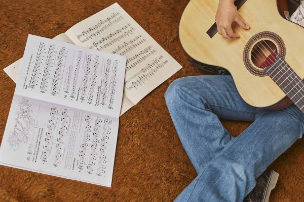 girl-playing-guitar-home